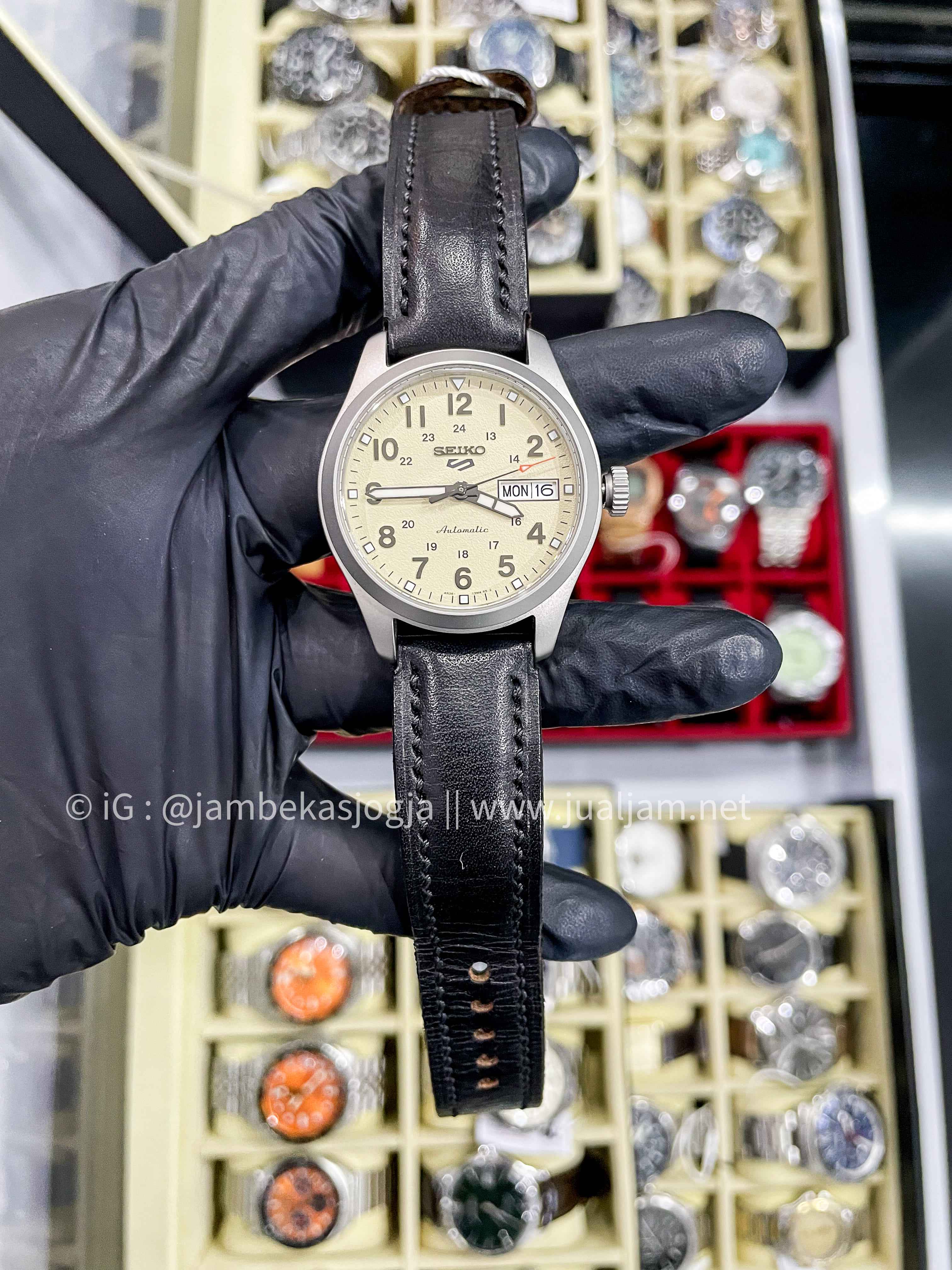 (SKU 385) Seiko 5 Sports SRPJ83K1 Mid-Field Sports Style Automatic Men Beige Dial Black Leather Strap